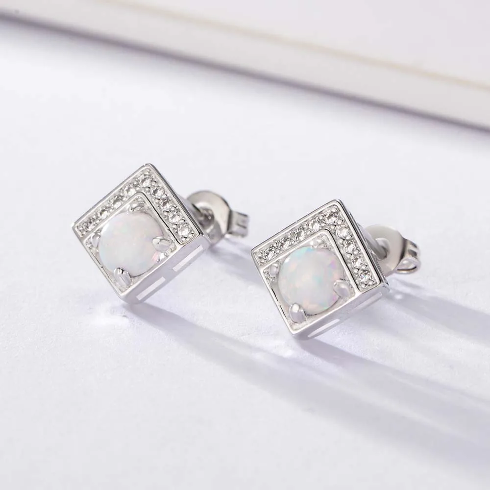 Square opal stud earrings in sterling silver with pavé CZ border, modern and elegant design for everyday wear.