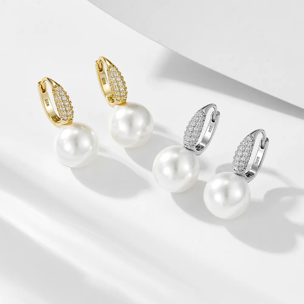 Hoop pearl earrings with pavé CZ accents, gold and silver plated 925 silver jewelry combining classic and modern style.