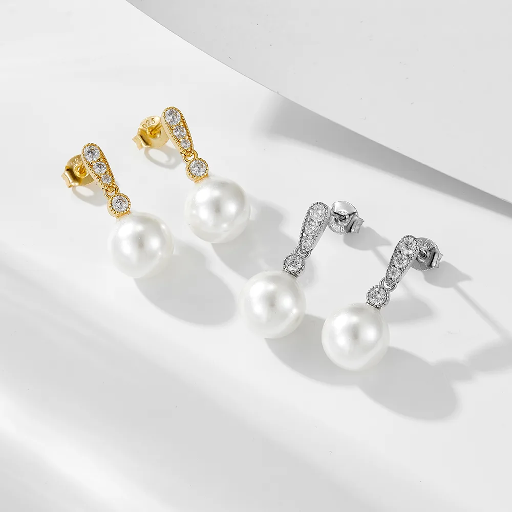 Pearl drop earrings with CZ-studded bar setting, elegant gold and silver jewelry crafted in 925 sterling silver.