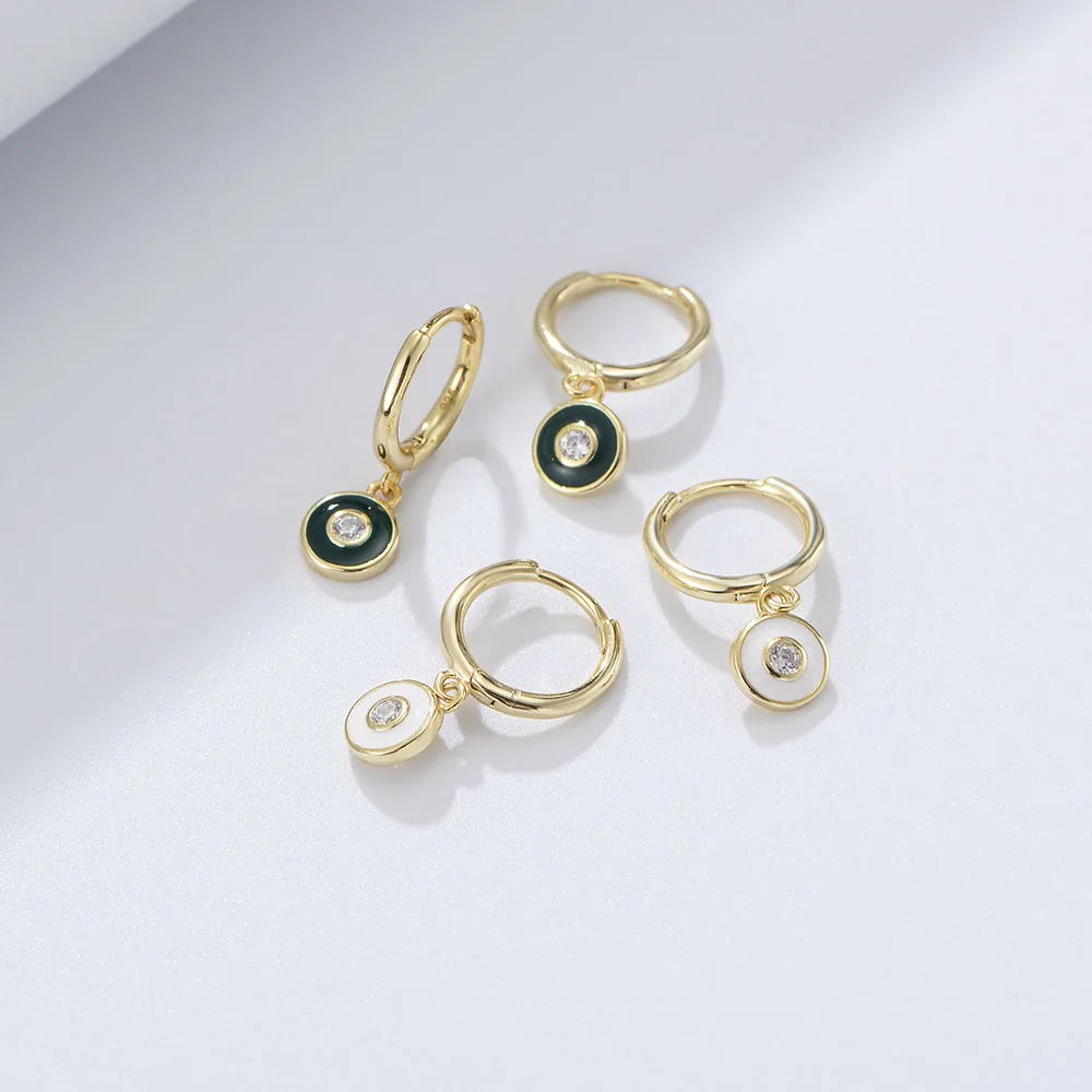 Gold hoop earrings with enamel round pendants in green and white, featuring CZ center stones for modern style.