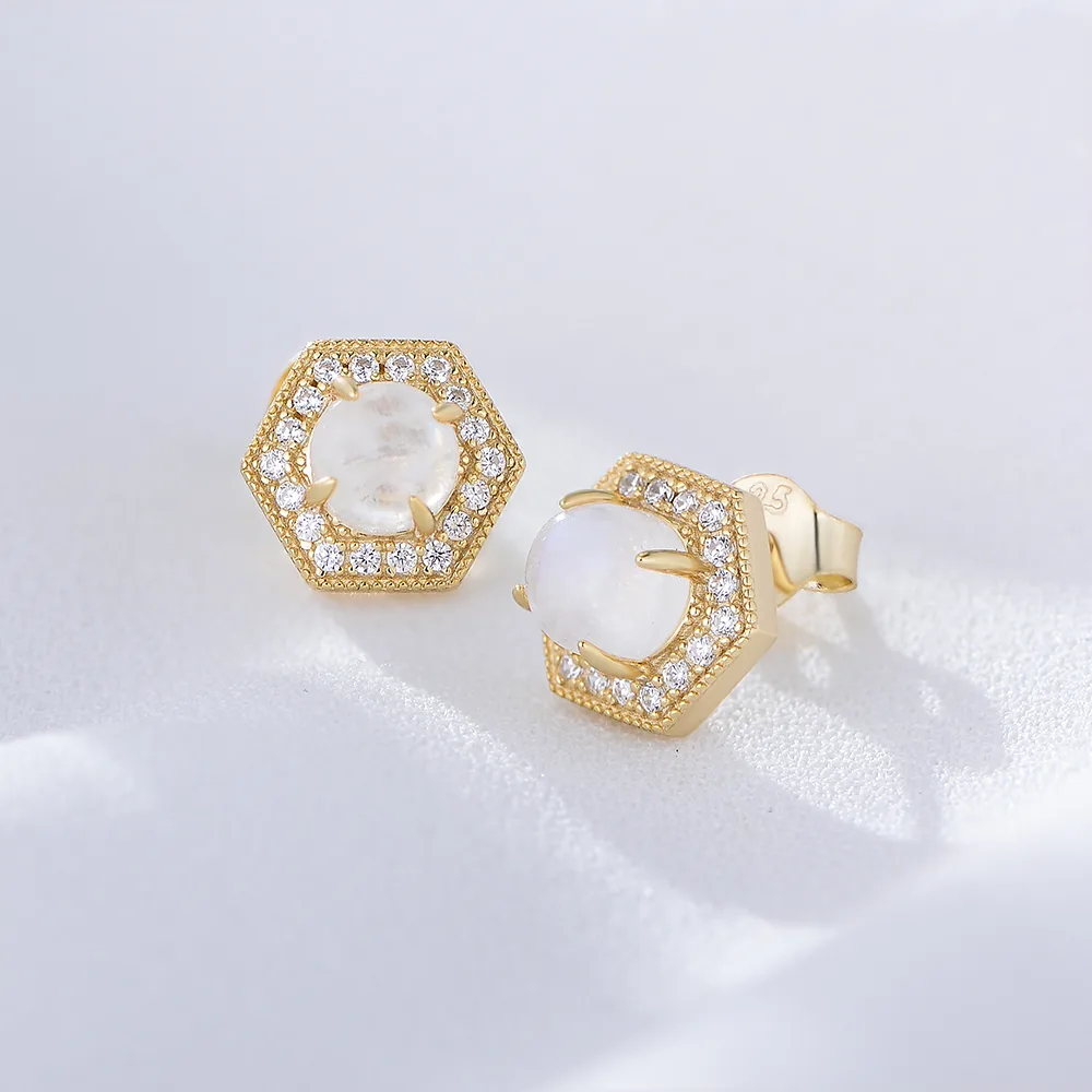 Gold hexagon moonstone stud earrings surrounded by pavé cubic zirconia, elegant 925 sterling silver jewelry.