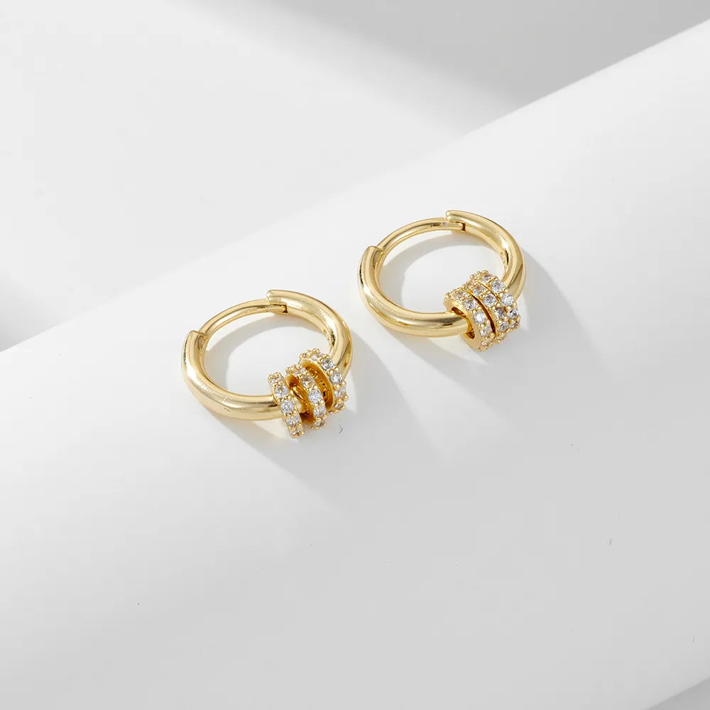 Gold hoop earrings with triple pavé cubic zirconia rings, elegant minimalist jewelry handcrafted in 925 sterling silver.