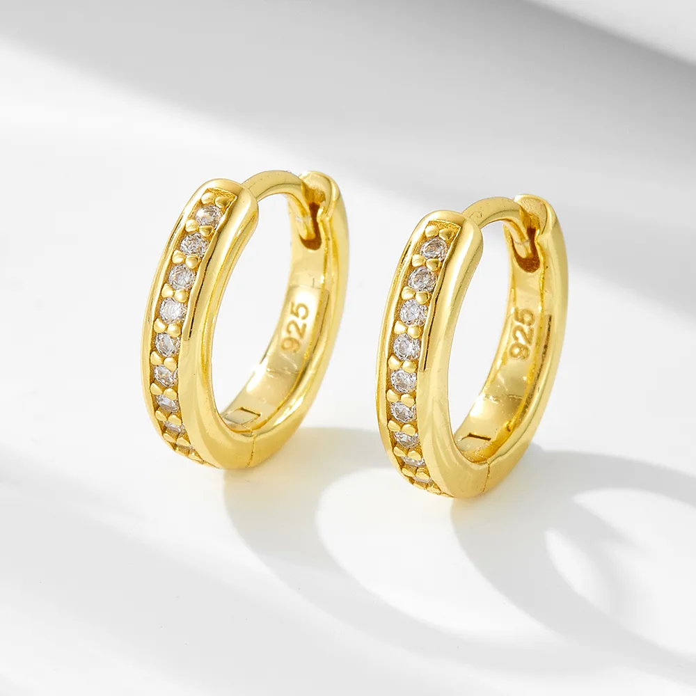 Gold hoop earrings with pavé cubic zirconia, timeless elegant jewelry made of 925 sterling silver.