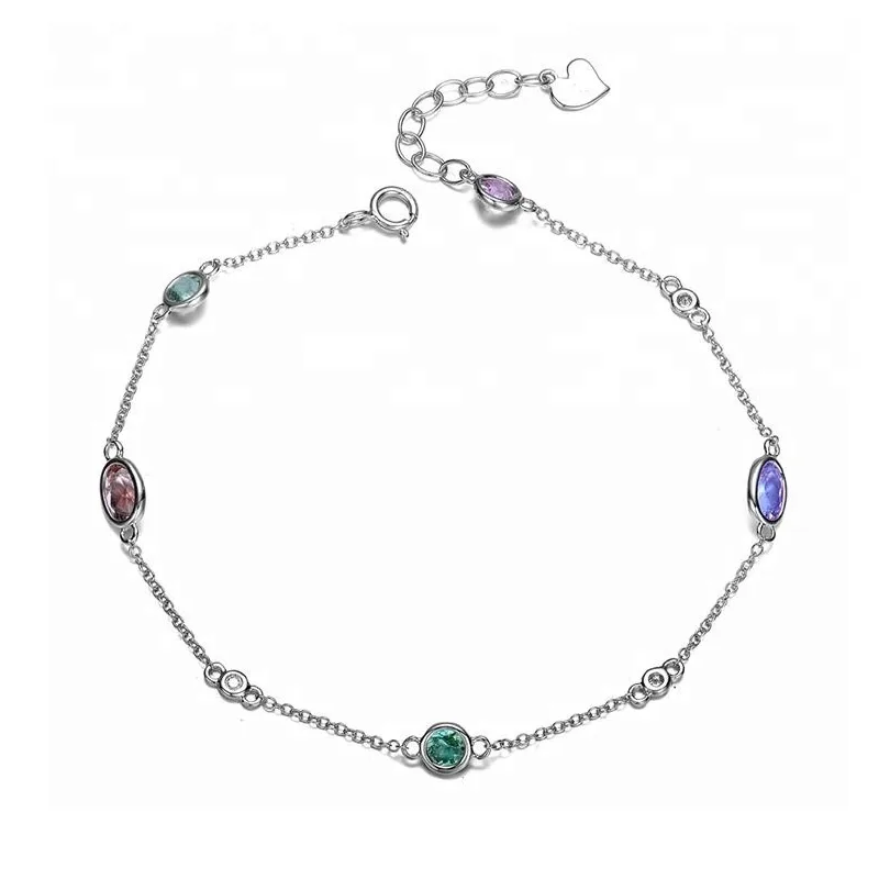 Multi gemstone bracelet with colorful oval-cut stones set in sterling silver, elegant boho jewelry style.
