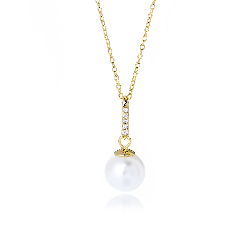 Elegant gold pearl pendant necklace with cubic zirconia accent, timeless minimalist jewelry handcrafted by Dorji Jewelry.