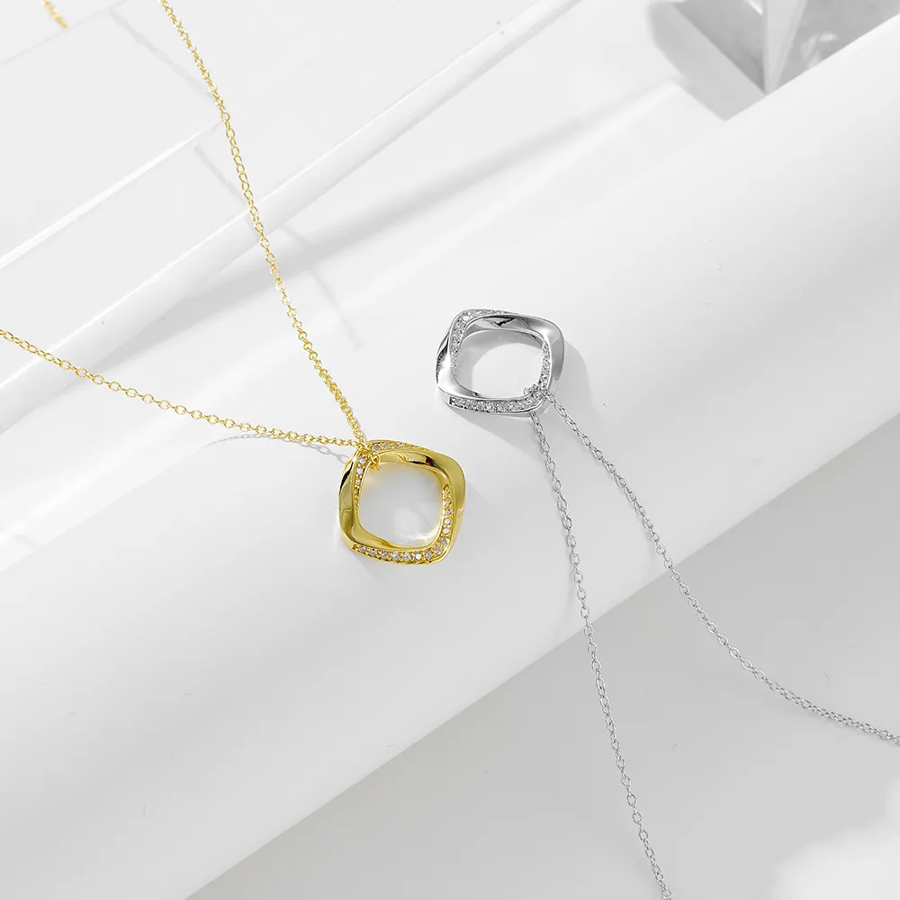 Square open pendant necklace in gold and silver tones, minimalist geometric jewelry for modern women.