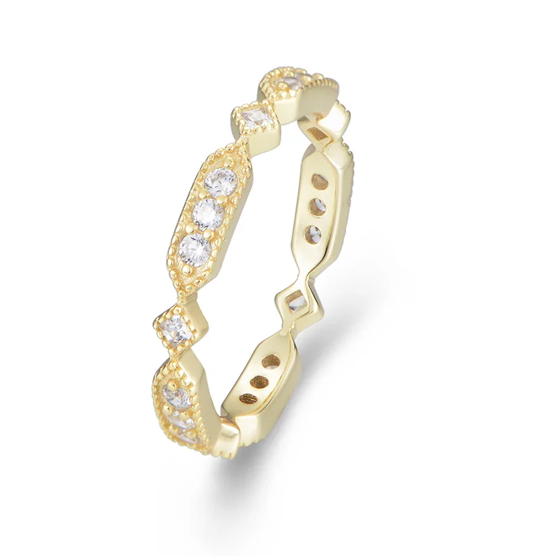 Geometric vintage-inspired gold ring with milgrain edges and round cubic zirconia accents.
