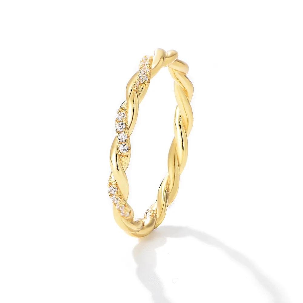 Gold plated twisted ring with pavé cubic zirconia, elegant braided band for minimalist jewelry collections.