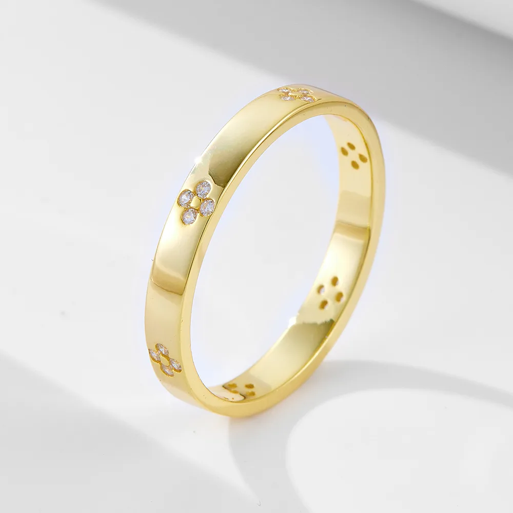 Gold ring with delicate floral CZ patterns, elegant minimalist jewelry crafted from 925 sterling silver.