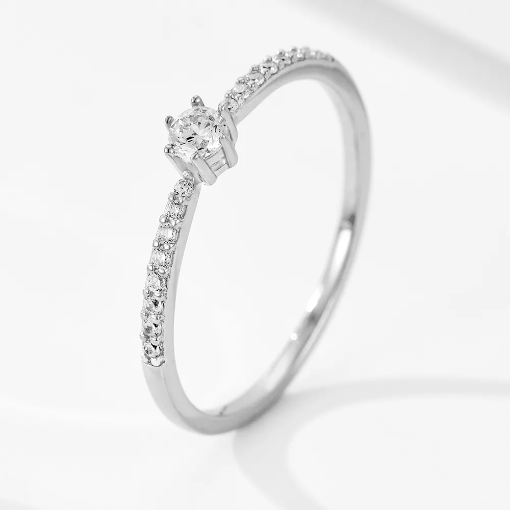 Solitaire CZ engagement-style ring with pavé band, crafted in 925 sterling silver for timeless elegance.