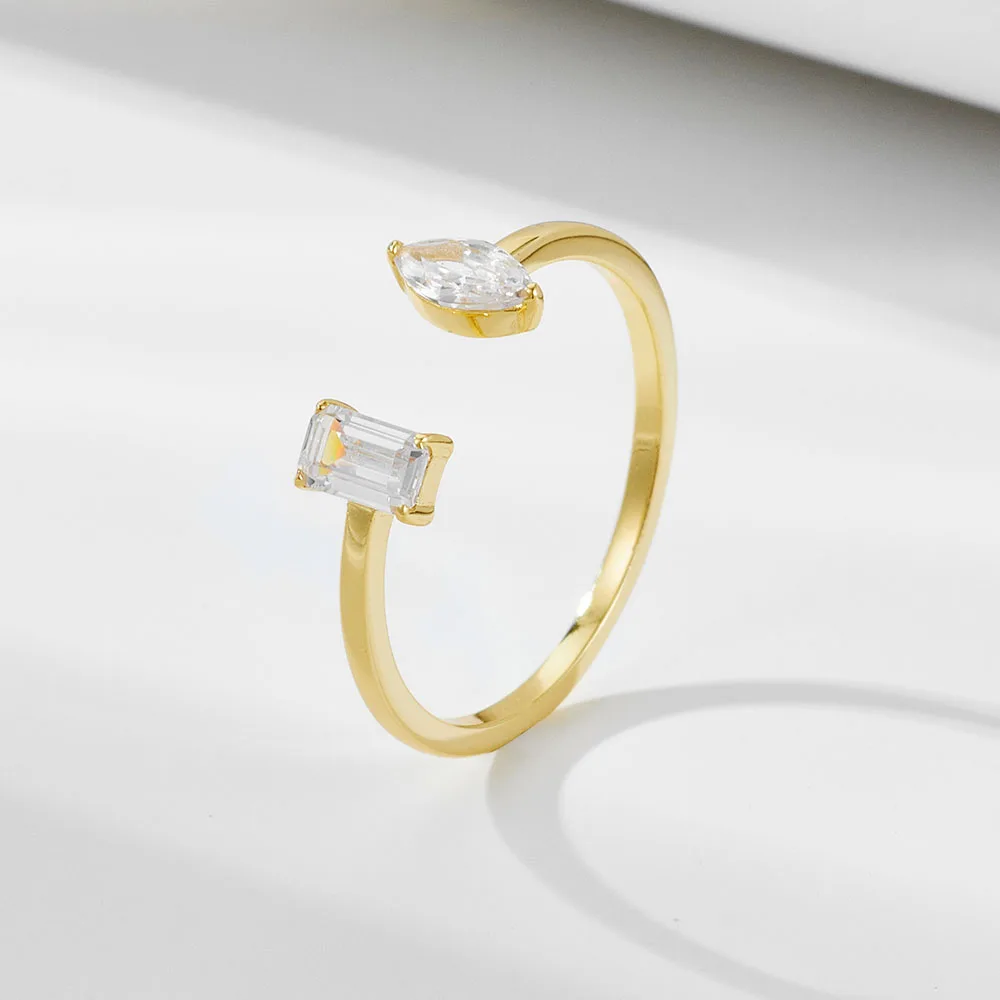 Open-end gold ring featuring marquise and baguette-cut cubic zirconia, modern adjustable design by Dorji Jewelry.